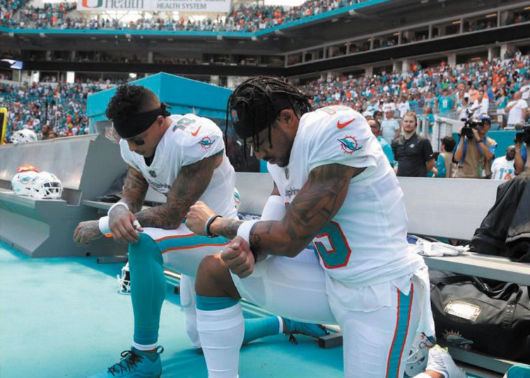 They stand up for justice by kneeling